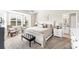 This spacious main bedroom features an ensuite bathroom, natural light from windows, and a walk-in closet at 5217 Chase Oaks Dr, Sarasota, FL 34241