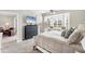 This bedroom boasts a large window and an entertainment center, creating a cozy retreat at 5217 Chase Oaks Dr, Sarasota, FL 34241