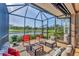Enjoy the outdoors on this screened-in patio with pond and golf course views at 5217 Chase Oaks Dr, Sarasota, FL 34241
