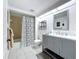 Bathroom with a gray vanity, modern fixtures, and shower with patterned curtain at 5234 Lake Arrowhead Trl # 30, Sarasota, FL 34231