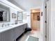 Bright bathroom with a double sink vanity and walk-in tub at 5234 Lake Arrowhead Trl # 30, Sarasota, FL 34231
