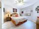 Bedroom featuring a large bed, neutral decor, and ample natural light at 5234 Lake Arrowhead Trl # 30, Sarasota, FL 34231