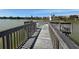 Picturesque wooden dock overlooking the serene lake at 5234 Lake Arrowhead Trl # 30, Sarasota, FL 34231