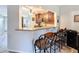 Open kitchen view with granite countertops, wood cabinets, and bar seating at 5234 Lake Arrowhead Trl # 30, Sarasota, FL 34231