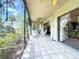 Covered lanai features tiled flooring, outdoor seating, a ceiling fan, and screened walls at 5234 Lake Arrowhead Trl # 30, Sarasota, FL 34231
