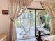 View of the landscaped backyard through the bedroom's sliding glass door that leads to the screened in lanai at 5234 Lake Arrowhead Trl # 30, Sarasota, FL 34231