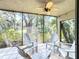 Relaxing screened-in lanai with comfortable seating and a ceiling fan, perfect for enjoying the outdoors at 5234 Lake Arrowhead Trl # 30, Sarasota, FL 34231