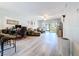 Spacious living area with wood floors, comfortable seating, and access to the outdoor patio at 5234 Lake Arrowhead Trl # 30, Sarasota, FL 34231