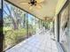 Inviting screened patio featuring tile flooring and views of lush landscaping at 5234 Lake Arrowhead Trl # 30, Sarasota, FL 34231