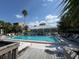 Inviting community pool with lounge chairs and a covered pavilion, perfect for relaxation and socializing at 5234 Lake Arrowhead Trl # 30, Sarasota, FL 34231