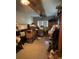 View of a cluttered living room, presenting an opportunity to visualize the space with personal design and organization at 6013 Idle A While Cir, Dade City, FL 33523