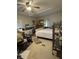 Main bedroom featuring ample natural light, a ceiling fan, and potential for a cozy retreat at 6013 Idle A While Cir, Dade City, FL 33523