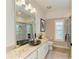 This bathroom features granite countertops, a black vessel sink, and a glass shower door at 6102 Sonesta Ct, Bradenton, FL 34202