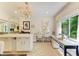 This well-lit craft room features sewing machines, a center island, and lots of storage at 6102 Sonesta Ct, Bradenton, FL 34202