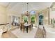Dining room with a chandelier, bright windows, and adjacent office space at 6102 Sonesta Ct, Bradenton, FL 34202