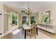 Dining room with a chandelier, large windows, and a decorative console table at 6102 Sonesta Ct, Bradenton, FL 34202