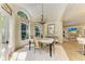 Bright dining room with a chandelier, large windows, and a white area rug at 6102 Sonesta Ct, Bradenton, FL 34202