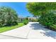 Lush trees and greenery accent this lovely home with a long, inviting driveway at 6102 Sonesta Ct, Bradenton, FL 34202