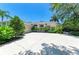 Welcoming single Gathering home boasting lush landscaping and a long, expansive driveway at 6102 Sonesta Ct, Bradenton, FL 34202