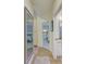 Hallway view showcasing access to bedrooms and bathrooms, enhanced by neutral tones and stylish decor at 6102 Sonesta Ct, Bradenton, FL 34202