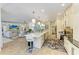 Open-concept kitchen with an island, bar stools, and views into the living room at 6102 Sonesta Ct, Bradenton, FL 34202