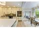 Spacious kitchen features custom cabinetry, stainless steel appliances, and adjacent breakfast nook at 6102 Sonesta Ct, Bradenton, FL 34202