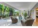Well appointed lanai features four wicker chairs surrounding a glass table overlooking the spa at 6102 Sonesta Ct, Bradenton, FL 34202