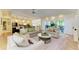 Open concept living space with access to kitchen, seating and sliding glass doors to the outdoor patio at 6102 Sonesta Ct, Bradenton, FL 34202