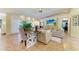 Open living room features tile flooring, neutral furniture, and a ceiling fan at 6102 Sonesta Ct, Bradenton, FL 34202