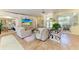 Open living room featuring comfortable seating, tile floors, and large windows at 6102 Sonesta Ct, Bradenton, FL 34202