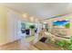 Bright and airy living room with tile floors and access to an outdoor patio at 6102 Sonesta Ct, Bradenton, FL 34202