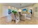 Bright living room featuring tile floors, neutral color palette, ceiling fan and access to outdoor patio at 6102 Sonesta Ct, Bradenton, FL 34202