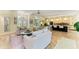 Open-concept living room features tile floors, comfortable seating, and access to kitchen at 6102 Sonesta Ct, Bradenton, FL 34202