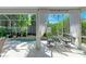 An indoor-outdoor pool area, complete with seating and lush landscaping, offers a serene retreat at 6102 Sonesta Ct, Bradenton, FL 34202