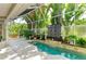 Indoor-outdoor pool area with a clear view of the beautiful plants, trees and landscape surrounding it at 6102 Sonesta Ct, Bradenton, FL 34202