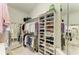 Spacious walk-in closet with extensive shelving, mirrored accents, and ample storage for clothes and shoes at 6102 Sonesta Ct, Bradenton, FL 34202