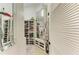 Organized walk-in closet with shelving, mirror, and a variety of storage solutions at 6102 Sonesta Ct, Bradenton, FL 34202