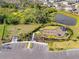 Aerial view of the community playground featuring a splash pad and a pond at 6314 Distant Haze Pl, Palmetto, FL 34221