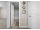 Entryway showcasing a bathroom with a white shower and decorative mirrors on the wall at 6314 Distant Haze Pl, Palmetto, FL 34221