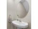 Bathroom with a pedestal sink and an oval mirror at 6314 Distant Haze Pl, Palmetto, FL 34221