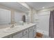 Bright bathroom features dual sinks, ample countertop space, a shower and tub at 6314 Distant Haze Pl, Palmetto, FL 34221
