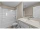 Bright bathroom features a shower-tub combo with a white single sink vanity at 6314 Distant Haze Pl, Palmetto, FL 34221