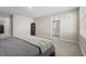 Bright main bedroom features neutral walls, soft carpet, and ensuite bathroom access at 6314 Distant Haze Pl, Palmetto, FL 34221