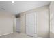 Hallway featuring neutral walls, white trim, and multiple doorways at 6314 Distant Haze Pl, Palmetto, FL 34221