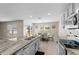 Bright kitchen featuring granite counters, stainless appliances, and an adjacent dining area at 6314 Distant Haze Pl, Palmetto, FL 34221