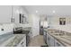 Well-equipped kitchen with granite countertops, stainless steel appliances, and a convenient center island at 6314 Distant Haze Pl, Palmetto, FL 34221