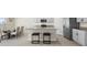 Modern eat-in kitchen with stainless steel appliances, granite countertops, and gray cabinetry at 6314 Distant Haze Pl, Palmetto, FL 34221