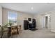 Bright living room featuring a dining table, home office setup, and neutral decor at 6314 Distant Haze Pl, Palmetto, FL 34221