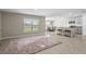 Open-concept living area seamlessly connects to the modern kitchen, creating a perfect space for entertaining at 6314 Distant Haze Pl, Palmetto, FL 34221