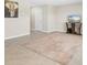 Bright living room featuring neutral walls, tile flooring, and stylish decor at 6314 Distant Haze Pl, Palmetto, FL 34221